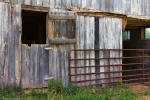 old barn and rusted gate